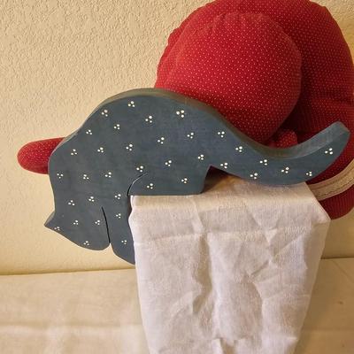 Two handmade cloth cats and a wooden shelf sitting cat