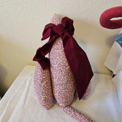 Two handmade cloth cats and a wooden shelf sitting cat