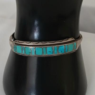 Antique Native American Zuni sterling silver cuff bracelet with flush turquoise channel inlay