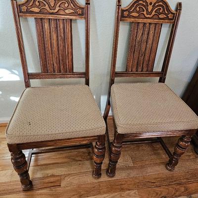 Antique English Jacobean Revival Oak table with pull out end leaves and six chairs