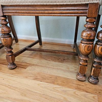 Antique English Jacobean Revival Oak table with pull out end leaves and six chairs