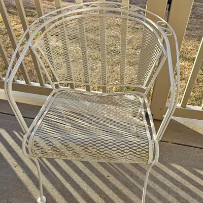 Heavy wrought iron patio table with Four nice chairs with cushions