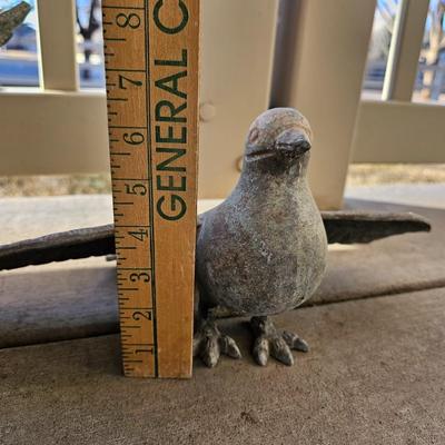 Two light metal Yard doves