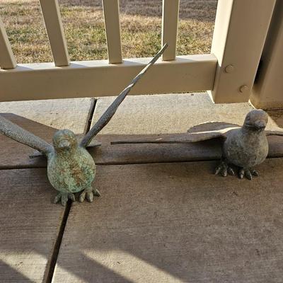 Two light metal Yard doves