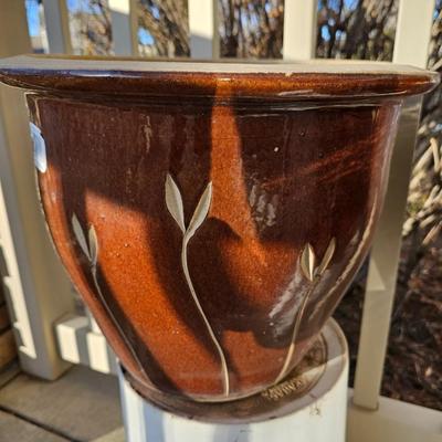 Two matching beautiful clay pottery flowerpots with leaf designs