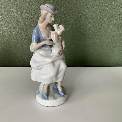 Lady with poodle, looks like Lladro