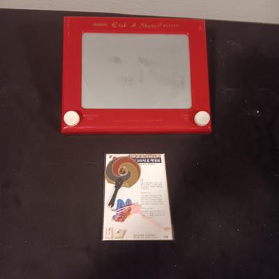 AN EARLY ETCH A SKETCH AND BOOKMARK