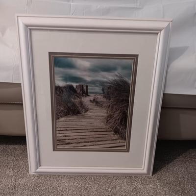 GILL COPELAND FRAMED PHOTO OF BEACH SCENE AND FAUX PLANT IN METAL VASE