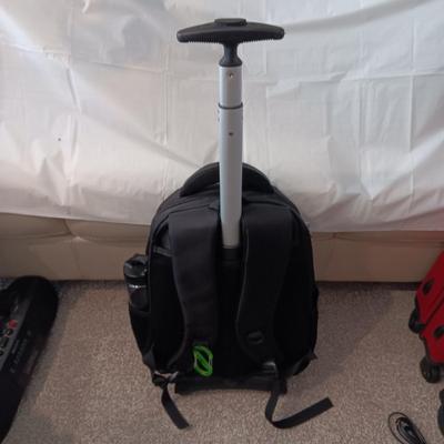 HUANLV TROLLEY BACKPACK, SONY RADIO ALARM CLOCK AND A SMALLER SUITCASE ON 4 WHEELS