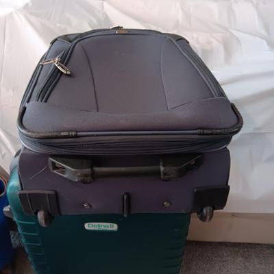 LARGE DELINA II HARDSIDE SUITCASE ON 4 WHEELS AND A CARRY ON WITH 2 WHEELS