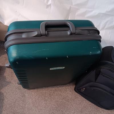 LARGE DELINA II HARDSIDE SUITCASE ON 4 WHEELS AND A CARRY ON WITH 2 WHEELS