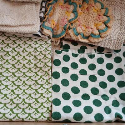 Assortment of coasters and kitchen hand towels with a few crocheted dish cloths