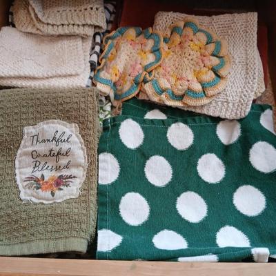 Assortment of coasters and kitchen hand towels with a few crocheted dish cloths