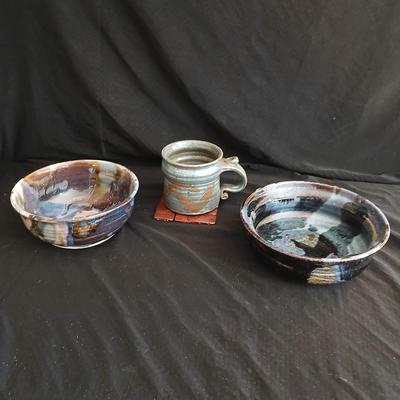 Signed pottery pieces - two bowls and a mug
