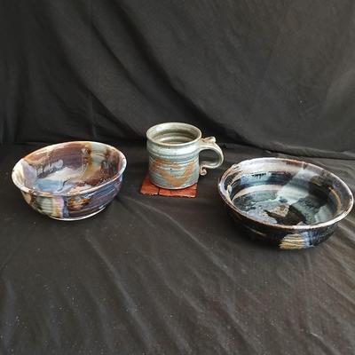 Signed pottery pieces - two bowls and a mug