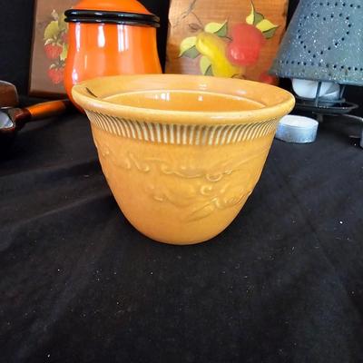 Small orange enamel sugar dish with hand painted wooden wall art, chalkware fruit and more