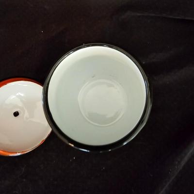 Small orange enamel sugar dish with hand painted wooden wall art, chalkware fruit and more