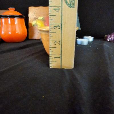 Small orange enamel sugar dish with hand painted wooden wall art, chalkware fruit and more