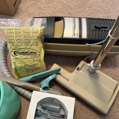 Electrolux vacuum and vintage garbage can