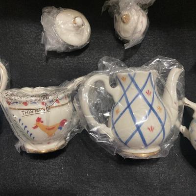 Seven Lenox Small Tea pots in boxes.