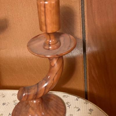2 wood candle sticks with totem pole decor