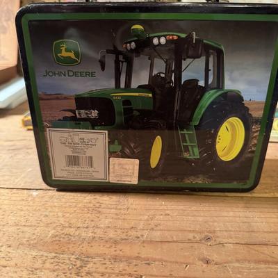 John Deere lunch box and books about tractors