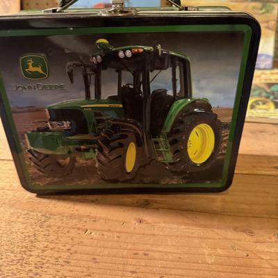 John Deere lunch box and books about tractors