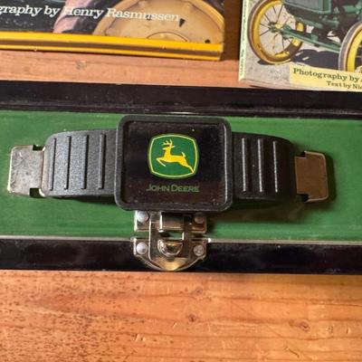 John Deere lunch box and books about tractors
