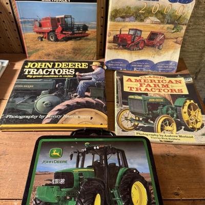 John Deere lunch box and books about tractors