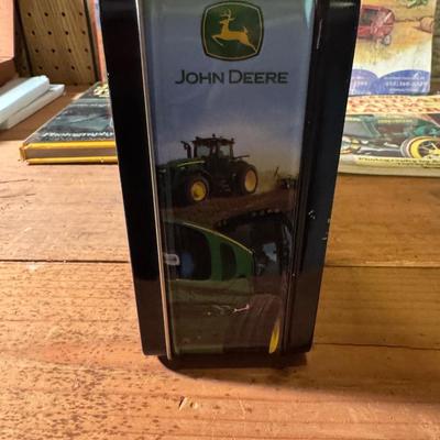 John Deere lunch box and books about tractors