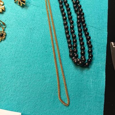 BLACK AND GOLD-TONE COSTUME JEWELRY