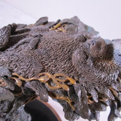 Joe Slockbower Mama, baby & one other sea otter sculpture