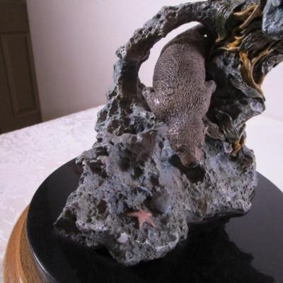 Joe Slockbower Mama, baby & one other sea otter sculpture