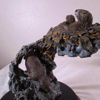 Joe Slockbower Mama, baby & one other sea otter sculpture