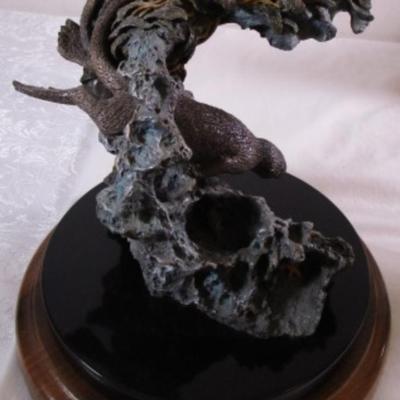 Joe Slockbower Mama, baby & one other sea otter sculpture