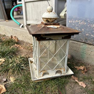 BIRD FEEDER WITH TOTE OF BIRD SEED AND HOSE HIDEAWAY