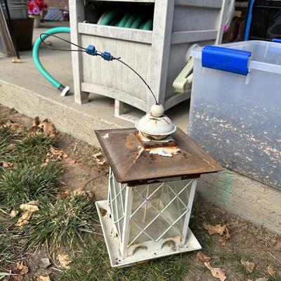 BIRD FEEDER WITH TOTE OF BIRD SEED AND HOSE HIDEAWAY