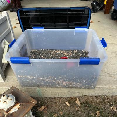BIRD FEEDER WITH TOTE OF BIRD SEED AND HOSE HIDEAWAY