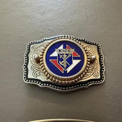 K OF C BELT BUCKLE AND 1976 DENVER BRONCOS BELT BUCKLE