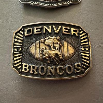 K OF C BELT BUCKLE AND 1976 DENVER BRONCOS BELT BUCKLE
