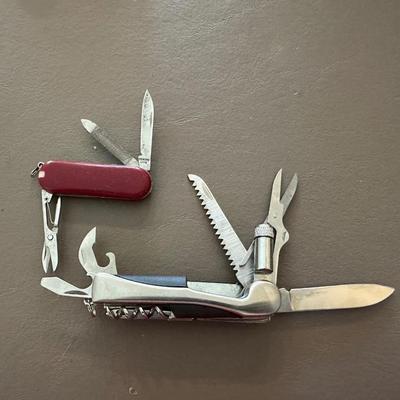 LIGHTER, 2 FOLDING MULTI FUNCTION POCKET KNIVES AND SMALL TAPE MEASURE