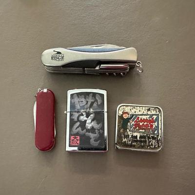 LIGHTER, 2 FOLDING MULTI FUNCTION POCKET KNIVES AND SMALL TAPE MEASURE