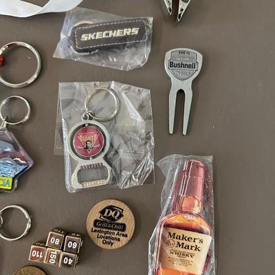 A COLLECTION OF KEYCHAINS, LANYARDS AND MORE