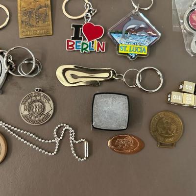 A COLLECTION OF KEYCHAINS, LANYARDS AND MORE
