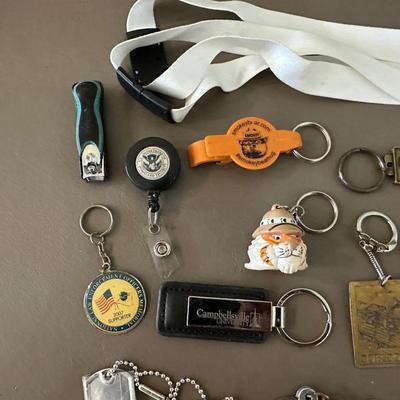 A COLLECTION OF KEYCHAINS, LANYARDS AND MORE