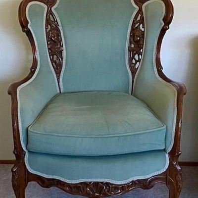 Vintage Green Chair With Carved Wood Design