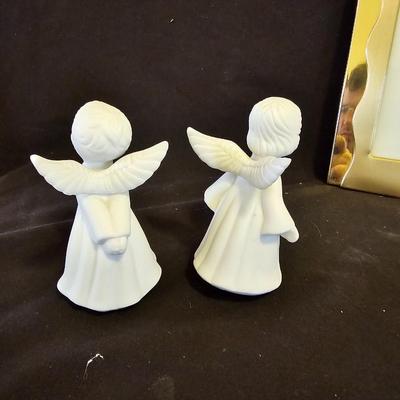Smaller Angel figures and a framed picture of Angel