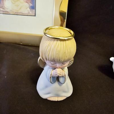 Smaller Angel figures and a framed picture of Angel