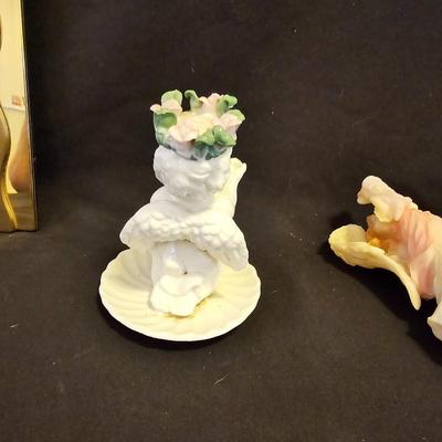 Smaller Angel figures and a framed picture of Angel