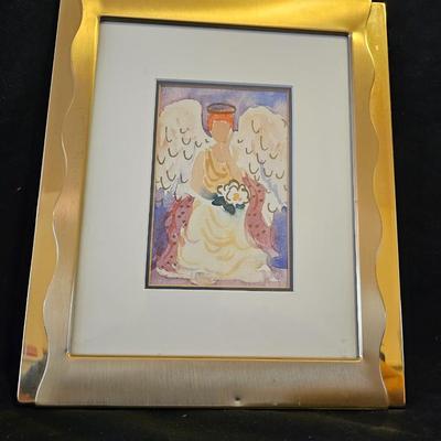 Smaller Angel figures and a framed picture of Angel